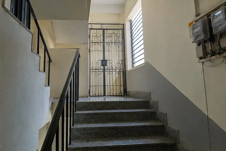 An ordinary building, an ordinary stairwell. Incall is less dramatic than men expect.